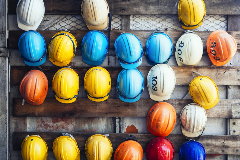 Wall with worker helmets hanging